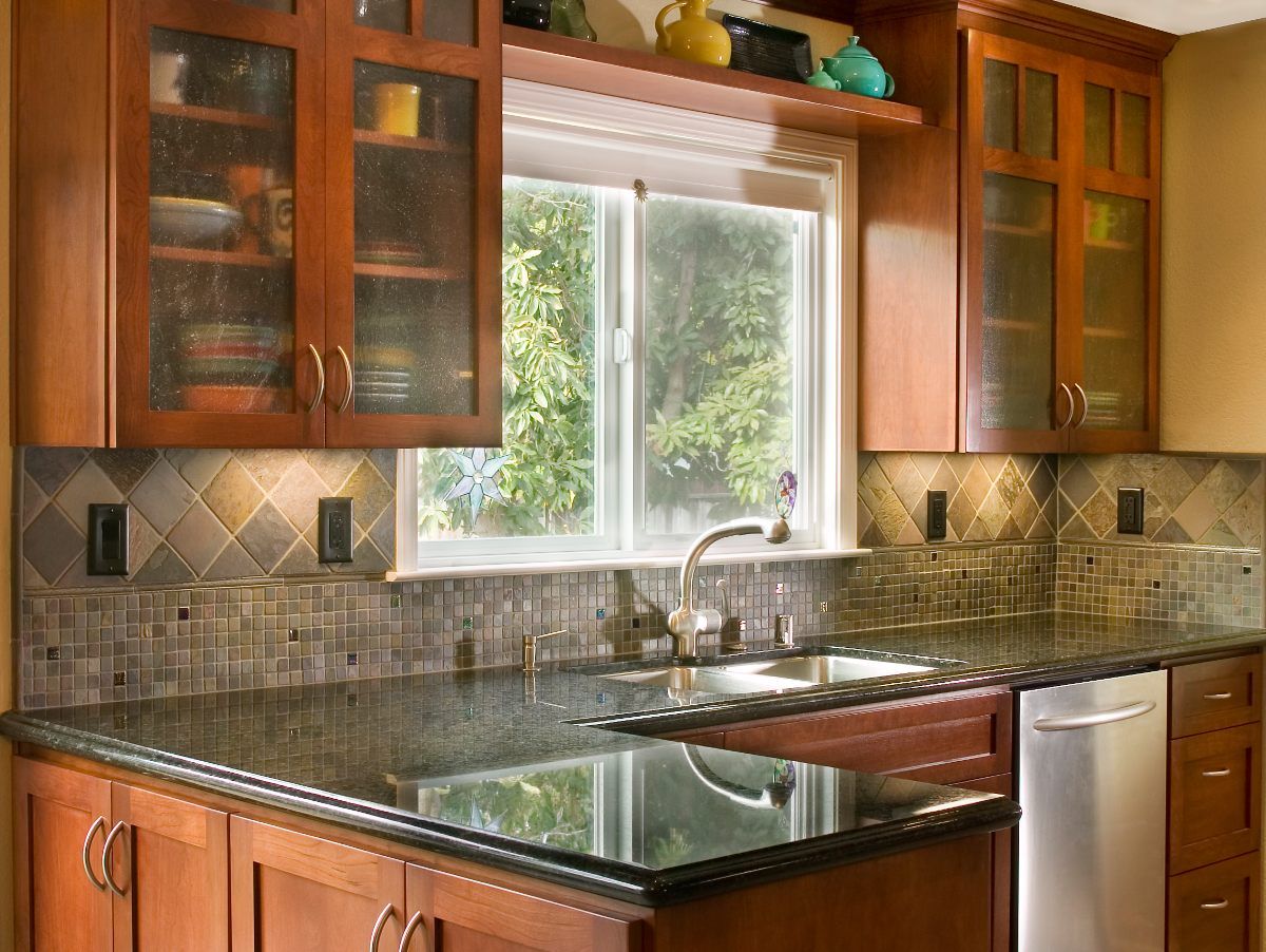 Cherry shaker cabinets, granite counters, slate floors, glass cabinets, slate mosaic splash